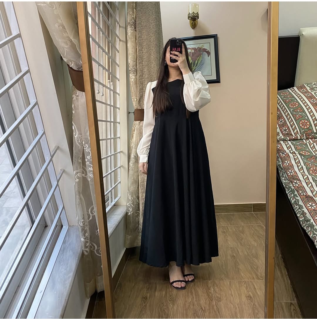 Step into elegance with this timeless black frock!