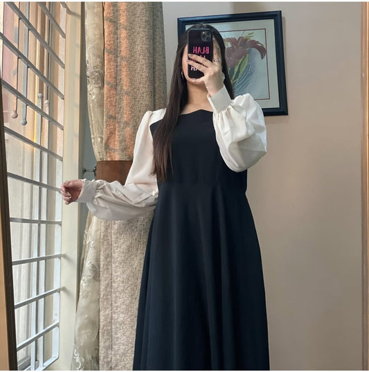 Step into elegance with this timeless black frock!